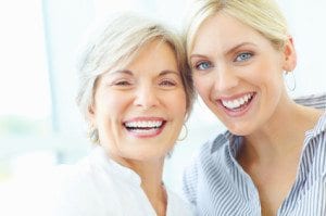 Two Women Smiling At Camera