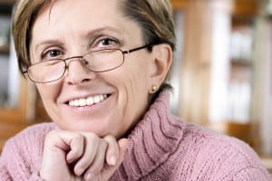 Older Female in Pink Turtleneck and Glasses