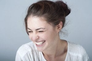 Brunette Smiling and Squinting Eyes