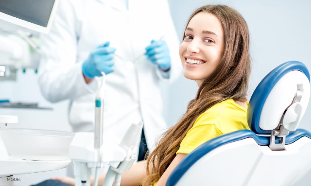 Young Girl Preparing for Wisdom Teeth Extraction In Dental Chair