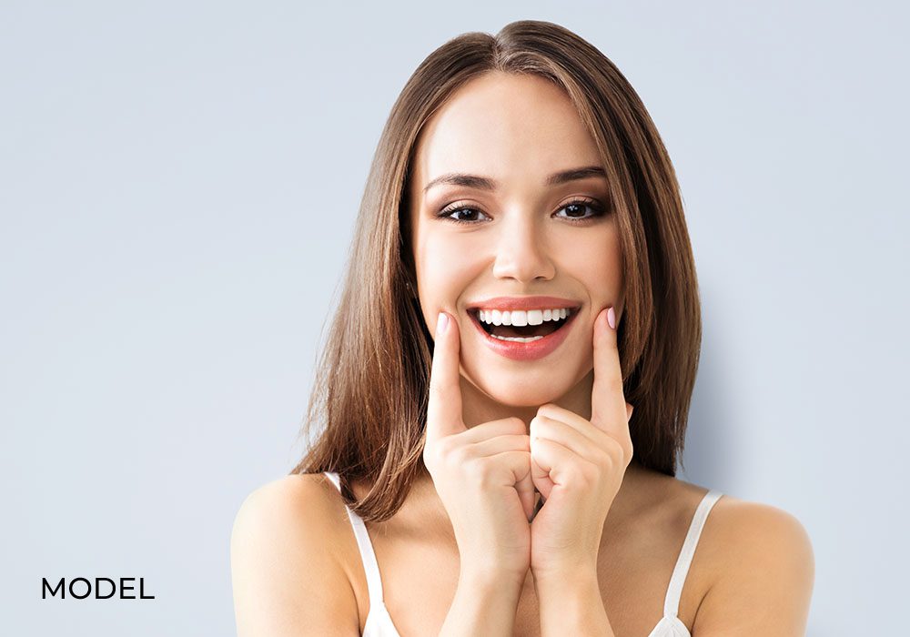 Smiling Brunette Woman Model for Dental Implants