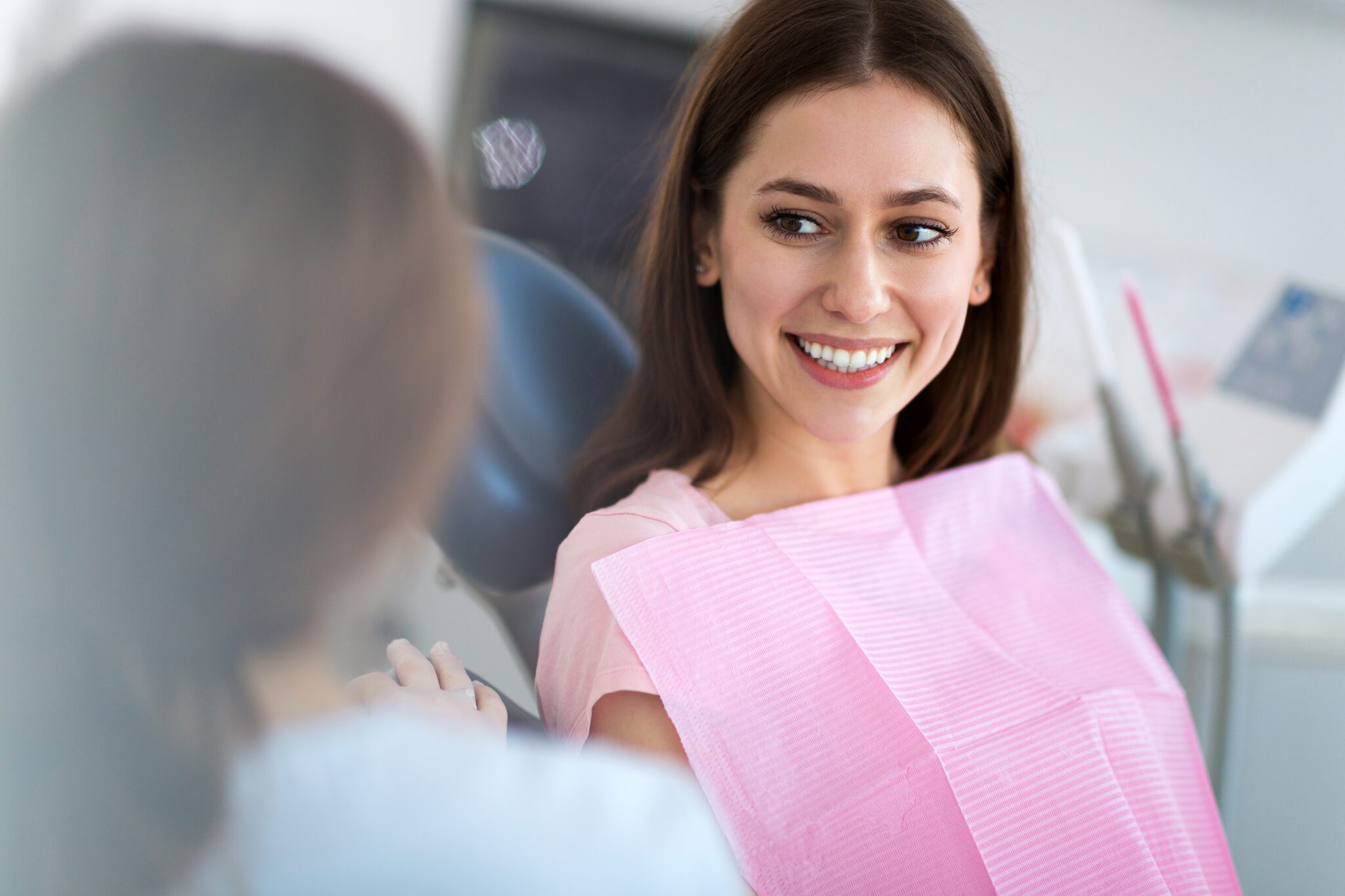 Dentist and patient in dentist office Dentist and patient in dentist office